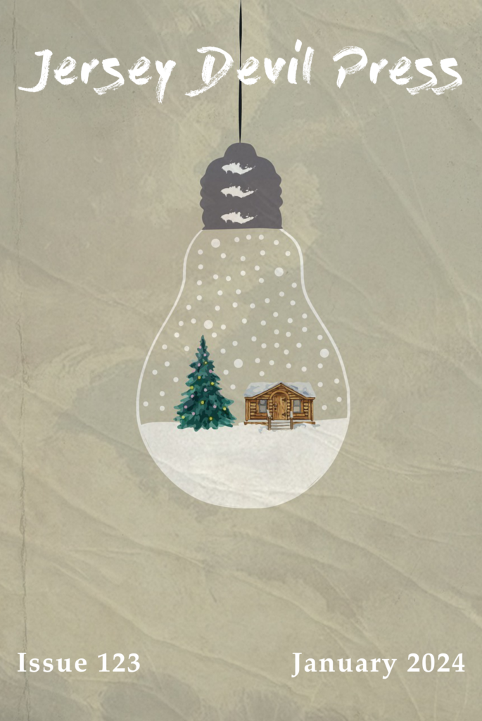 A hanging incandescent light bulb holds a cozy winter snowglobe scene with a cabin and a pine tree